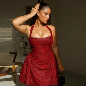 Detail of red and black floral halter neck dress with pleated A-line skirt and open back