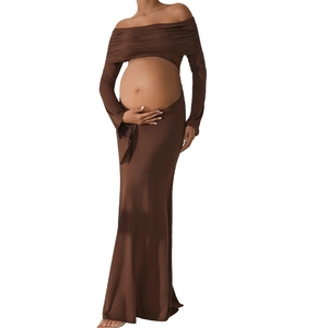 Detailed view of dark brown off-shoulder maternity dress with waist cutout design
