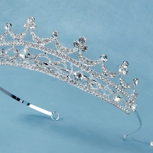 Detailed side view of baroque bridal crown with sparkling crystals and silver frame