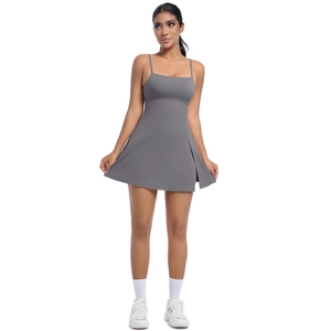 Detail view of the slim-fit grey athletic dress showing thin straps and side slit design