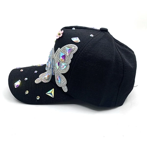 Black cotton baseball cap with colorful rhinestone butterfly and glittering diamond accents