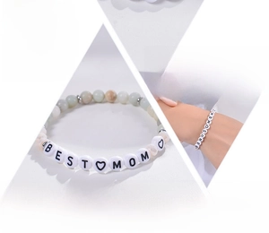 Detailed view of elastic Amazonite bead bracelet with Best Mom letter charms and gold accents