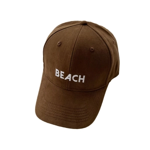 Classic coffee brown baseball cap with white embroidered BEACH logo on a cotton fabric