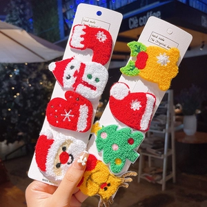 Set of 8 cute Christmas embroidered plush hair clips featuring Santa and snowman motifs