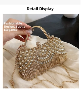 Detailed macro view of the gold rhinestone evening bag showing luxurious fan-shaped crystals
