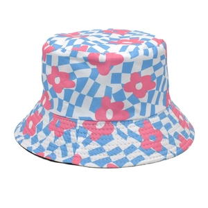 Detail of colorful daisy floral print on blue checkered pattern canvas bucket hat