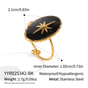 Detail of vintage black enamel star ring in stainless steel with size and weight specs
