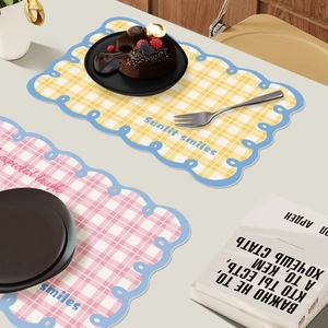 Waterproof leather placemats with yellow and pink grid patterns and blue wavy edges