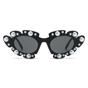 Chic black sunglasses with pearl accents, trendy pearl decorated sunwear for women.