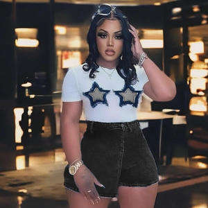 Women's white cropped T-shirt with blue star patchwork and black denim skirt outfit