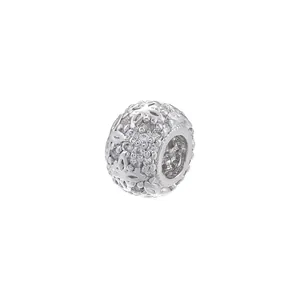 Macro detail of copper zircon wheel bead with butterfly pattern and 8.5mm length measurement