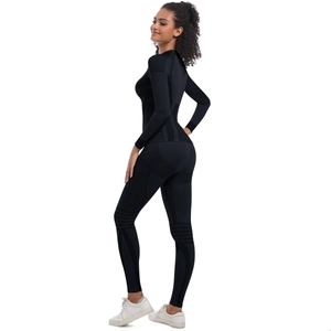 Detail of black compression yoga set showing breathable textures and ergonomic fit