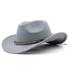 Detail of grey wool felt cowboy hat featuring ethnic woven band and leather buckle