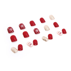 Short square red Christmas press-on nails with cute reindeer and snowflake designs