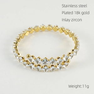 Detailed macro view of 18k gold plated stainless steel bracelet with inlaid zircons
