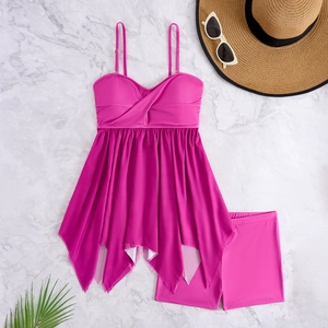 Detailed flat lay of rose pink two-piece tankini set with ruffle hem and swim shorts