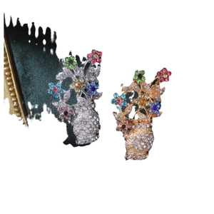 Vintage Baroque floral vase brooches with colorful rhinestones in gold and silver finish