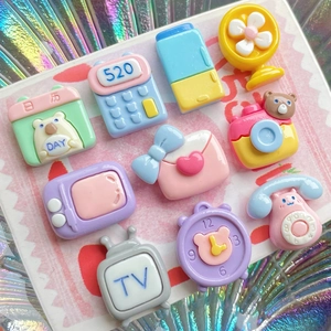 Mix of colorful resin DIY charms including retro TV, camera, and calendar shapes