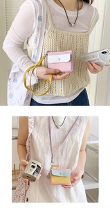 Detail of macaron-colored PU leather neck card holders with metal snaps and colorful straps