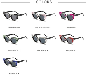 Flat lay view of seven color variations for oversized cat-eye sunglasses with rhinestones