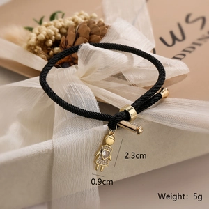 Detail of 18K gold plated girl pendant on black drawstring bracelet with size dimensions