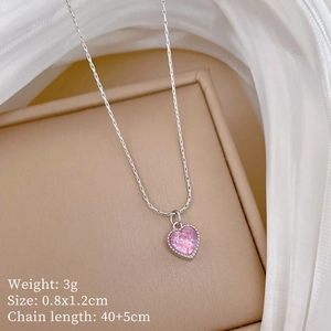 Detailed view of a silver necklace with pink heart gemstone and 40+5cm chain specs