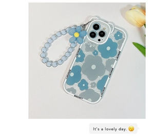 Detail of clear iPhone case with blue flower print and matching beaded wrist strap