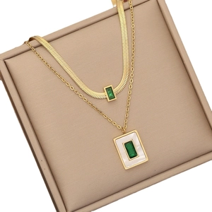 Double-layered gold stainless steel necklace with green emerald-cut square pendants