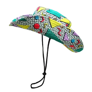 Detail of colorful geometric print cowboy hat with adjustable chin strap and air vents