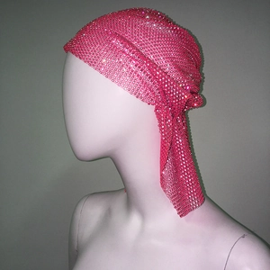 Detail view of hot pink rhinestone mesh headscarf with glittering stones on a mannequin head