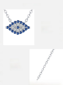 Macro view of S925 silver Evil Eye pendant with inlaid blue and white zircons