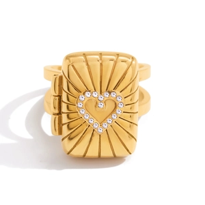 Macro shot of 18K gold plated square locket ring with a sparkling heart diamond inlay