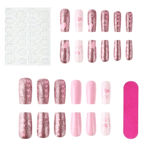 Pink heart glossy press-on nails set with 24 pieces, glitter designs, and tool kit