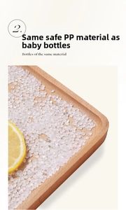 Close-up of food-grade PP material granules in a wooden tray with a lemon wedge
