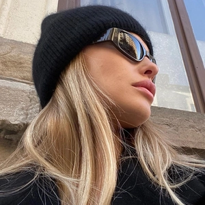 Fashionable black ribbed beanie paired with retro narrow-frame sunglasses for men and women