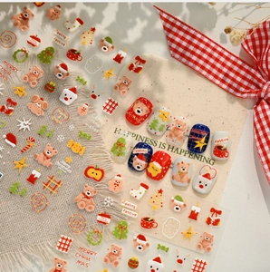 Macro detail of Christmas bear nail stickers featuring embossed 3D festive holiday designs