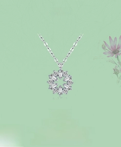 Detailed close-up of s925 silver floral pendant with radiant zircons on an O-chain link