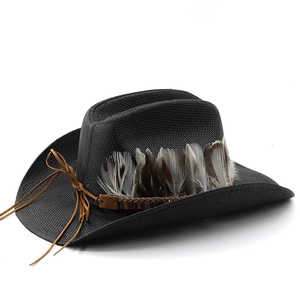 Close-up of black straw cowboy hat featuring natural feathers and brown braided cord