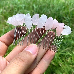 Close-up of handmade 20-tooth hair comb with natural raw pink and clear crystal stones
