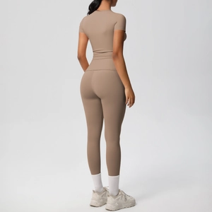 Detail view of the seamless tan two-piece workout set featuring high-waist leggings and top