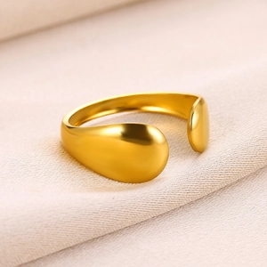 Detail of 18k gold plated stainless steel open ring with polished teardrop ends
