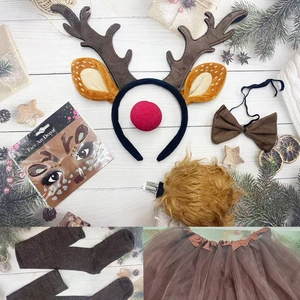 Flat lay of reindeer costume set with antlers, red nose, tutu, and festive decor for Christmas