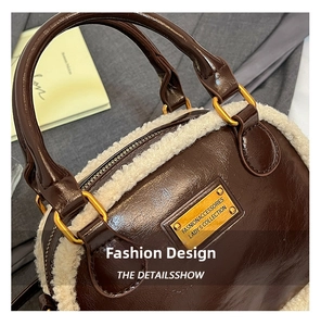Detail of retro cylinder bag with dark brown PU leather and cream sherpa fleece trim