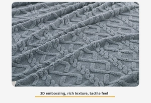 Detail of 3D embossed geometric pattern on gray thickened fleece blanket fabric