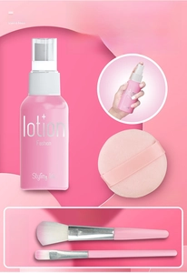 Detail of pink toy spray bottle with cosmetic brushes and puff for pretend play