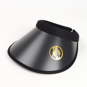 Detailed close-up of a black UPF50+ sun visor with wide brim and UV protection label