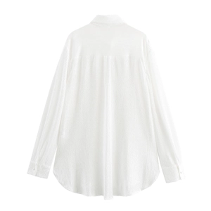 Back view of white textured long sleeve shirt with 3D flower decor and pleated details