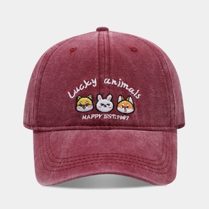 Macro shot of Lucky Animals embroidery on a vintage washed burgundy baseball cap