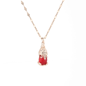 Rose gold titanium necklace featuring a red gemstone pendant and sparkling crystals