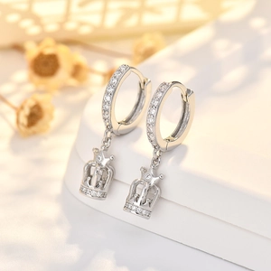 Elegant silver crown drop earrings with sparkling zircon stones on a white background